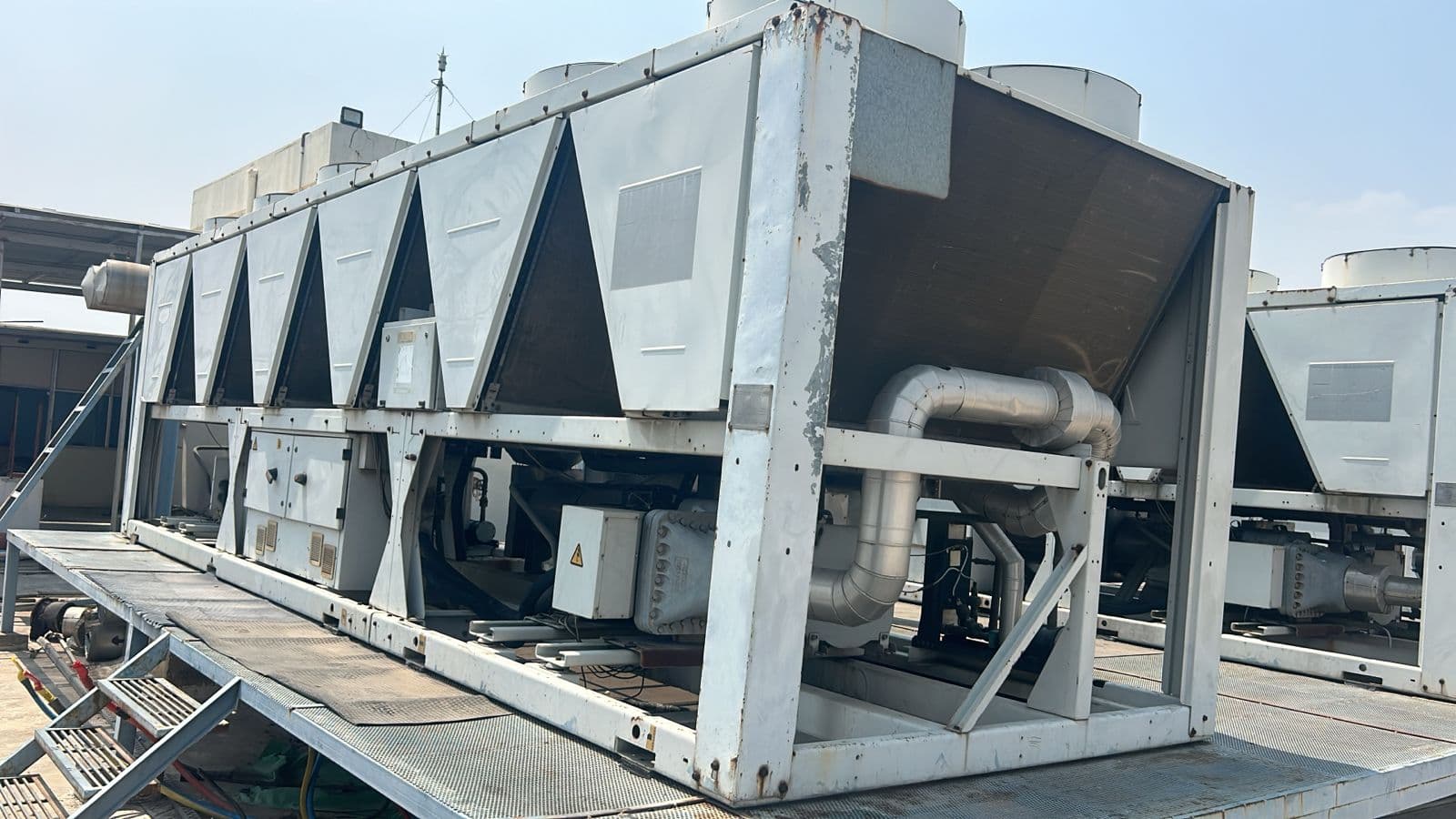 Aarohan Enterprises - Reinforced Concrete Crusher Operations: Crushing and sorting of reinforced masonry debris during industrial plant clearance. (Photo 066)